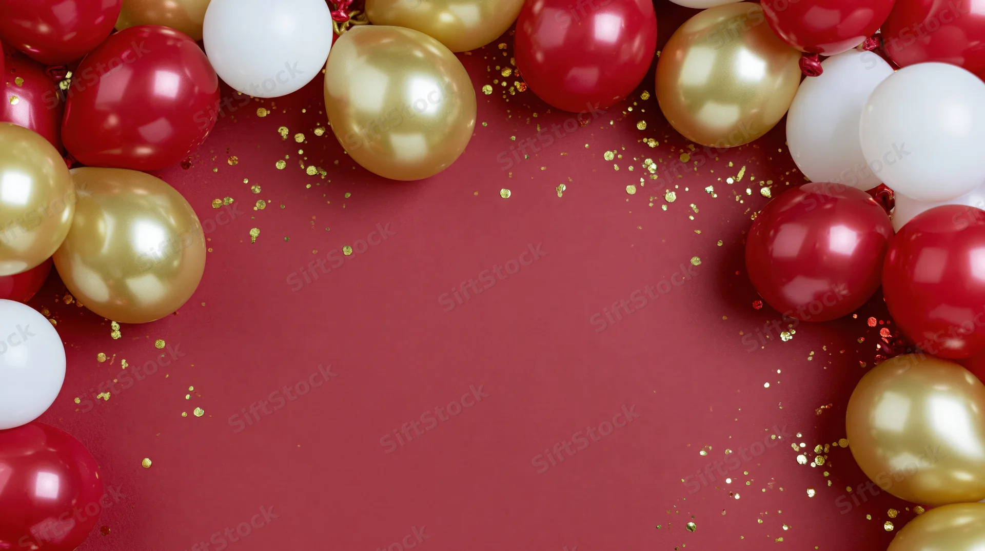Glossy red gold and white balloons arranged in a frame on red surface with glitter and copyspace