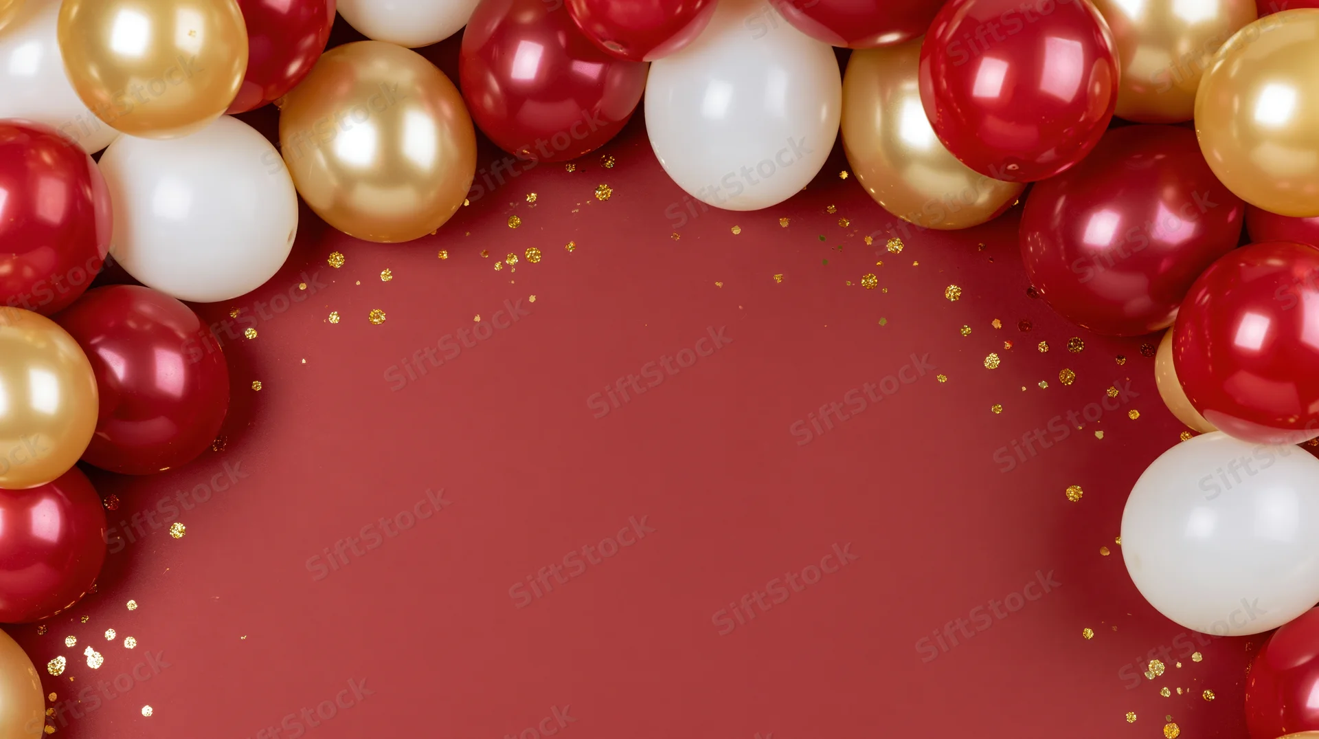 Glossy red gold and white balloons arranged in a frame around a red surface with gold glitter confetti and copyspace in center