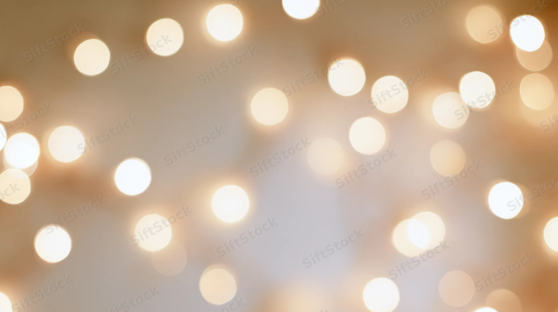 Soft out of focus bokeh lights creating warm glowing background