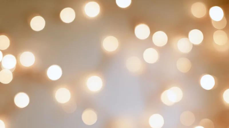 Soft out of focus bokeh lights creating warm glowing background