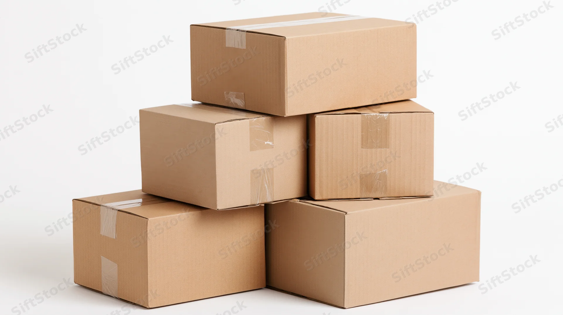 Stack of sealed cardboard shipping boxes piled in a pyramid shape on a white background