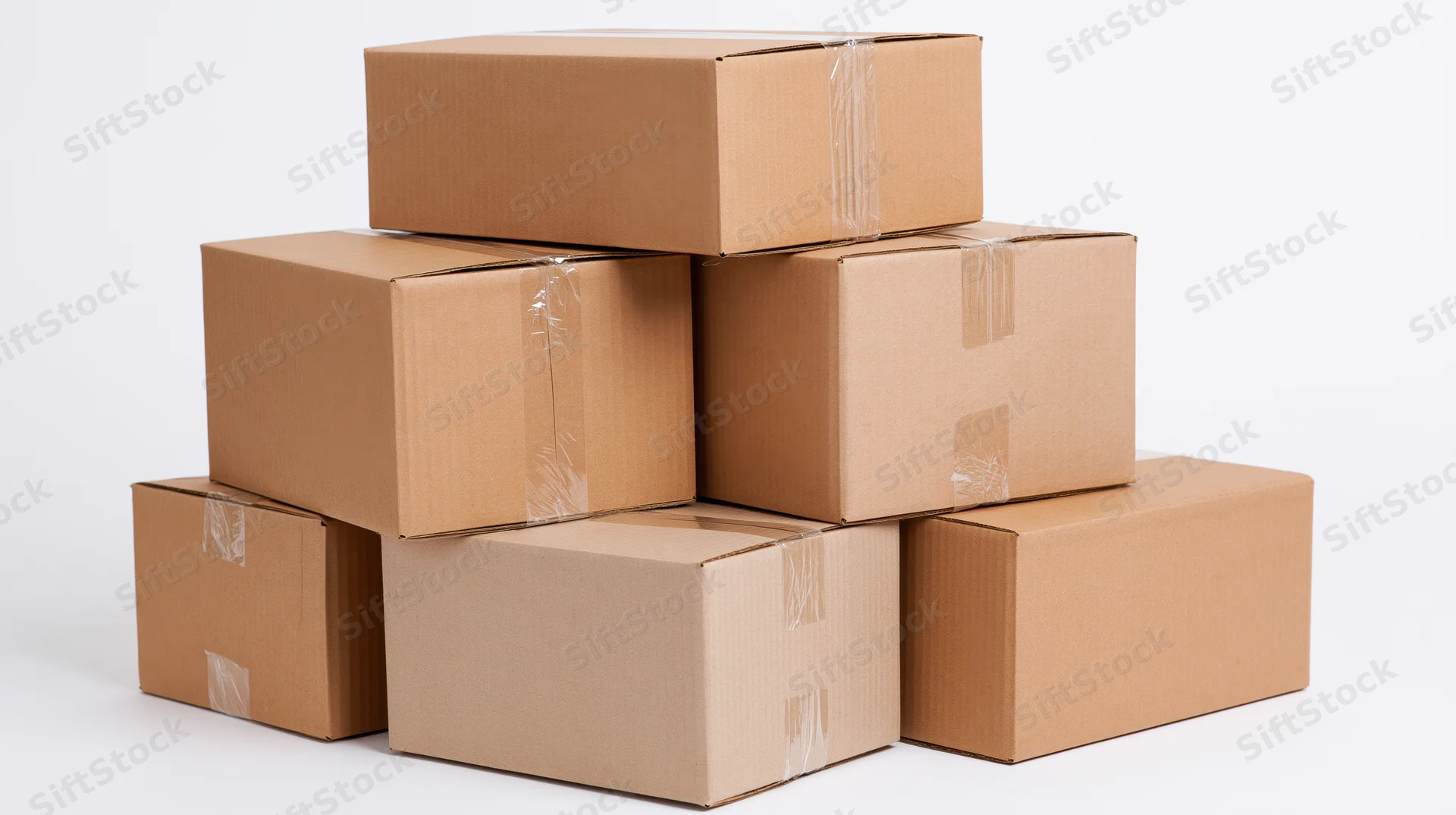 Stack of sealed corrugated cardboard shipping boxes piled on white background