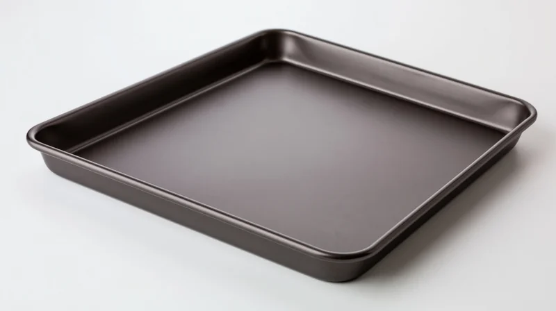 Dark grey nonstick baking sheet pan empty on white background