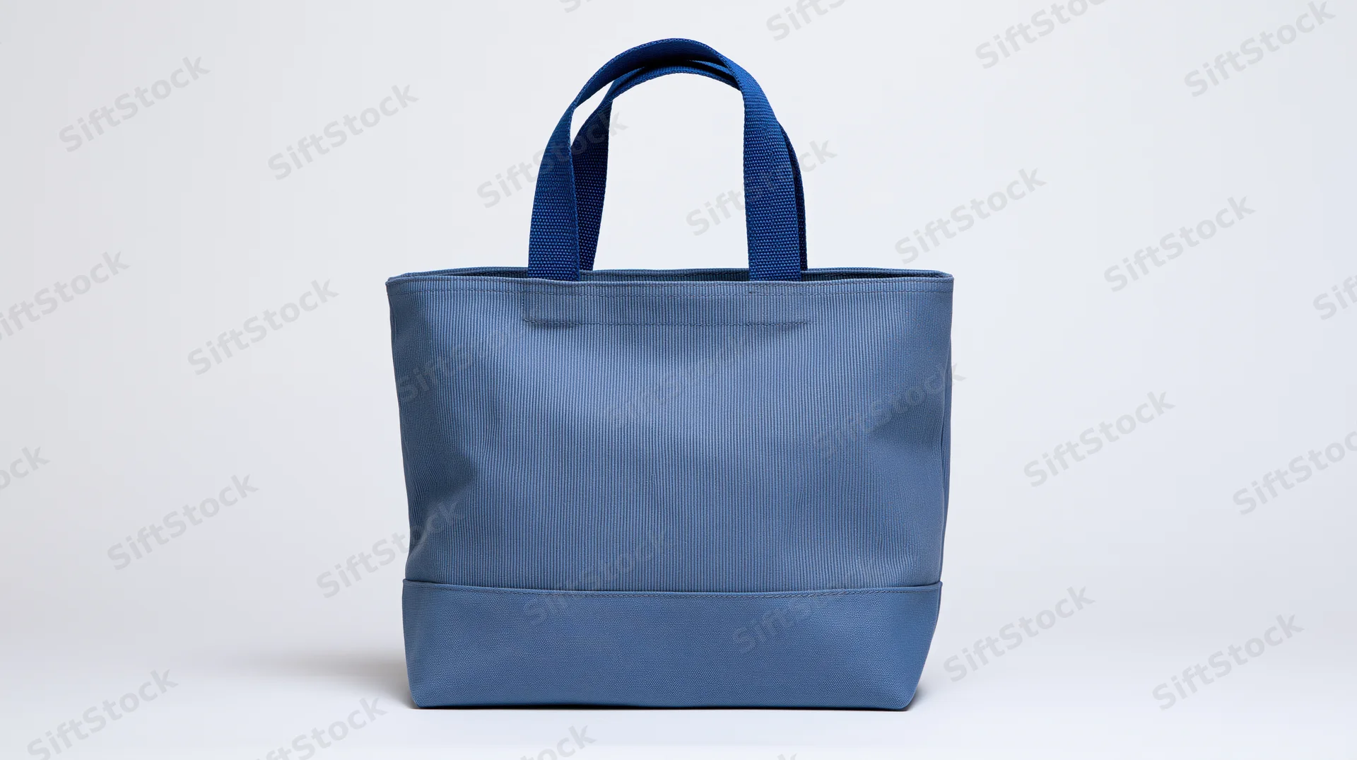 Blue canvas tote bag with dual handles centered on white background