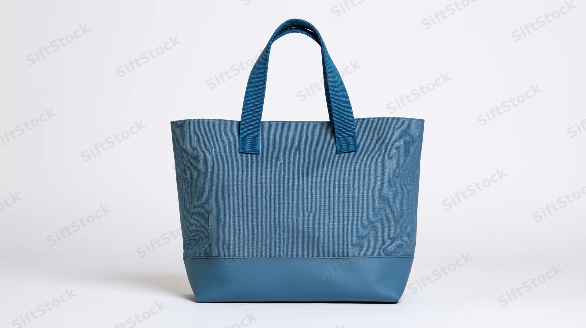 Blue canvas tote bag with dual handles centered on white background