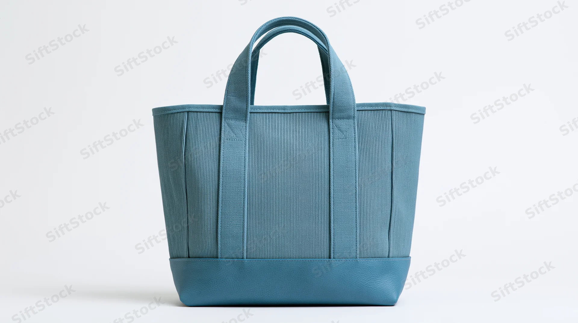 Dusty blue canvas tote bag with ribbed texture on white background