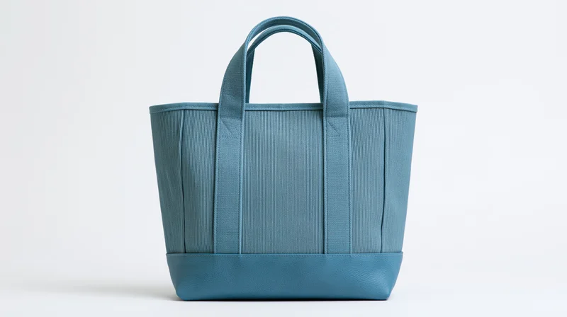 Dusty blue canvas tote bag with ribbed texture on white background