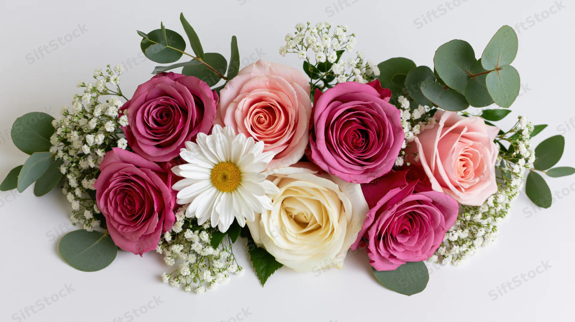 Horizontal floral arrangement of pink and white roses with eucalyptus and baby's breath on white background