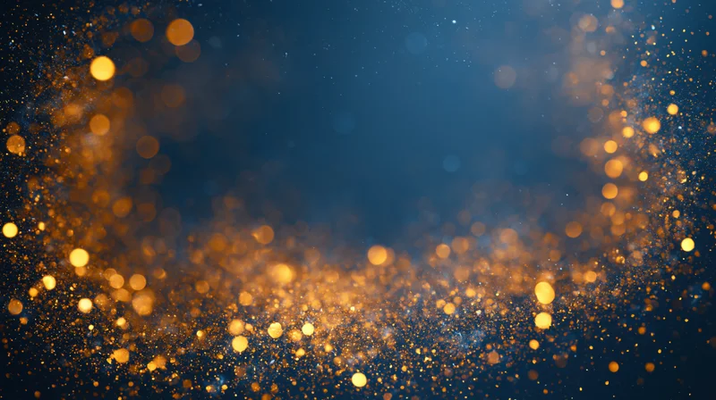 Golden bokeh lights scattered across a dark blue abstract background with copyspace in center