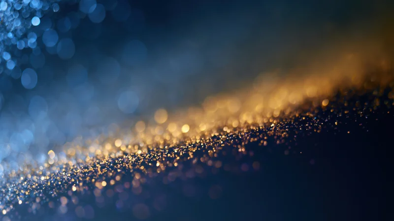 Abstract bokeh background with scattered out-of-focus lights in blue and gold tones