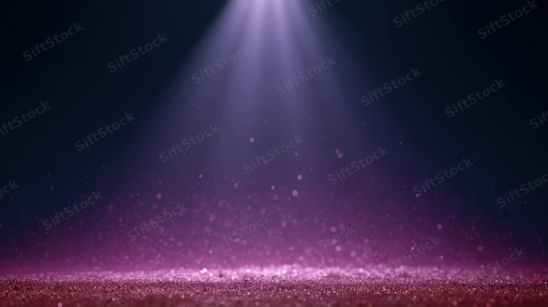 Spotlight beam illuminating glittering stage floor with floating dust particles in dark ambient setting