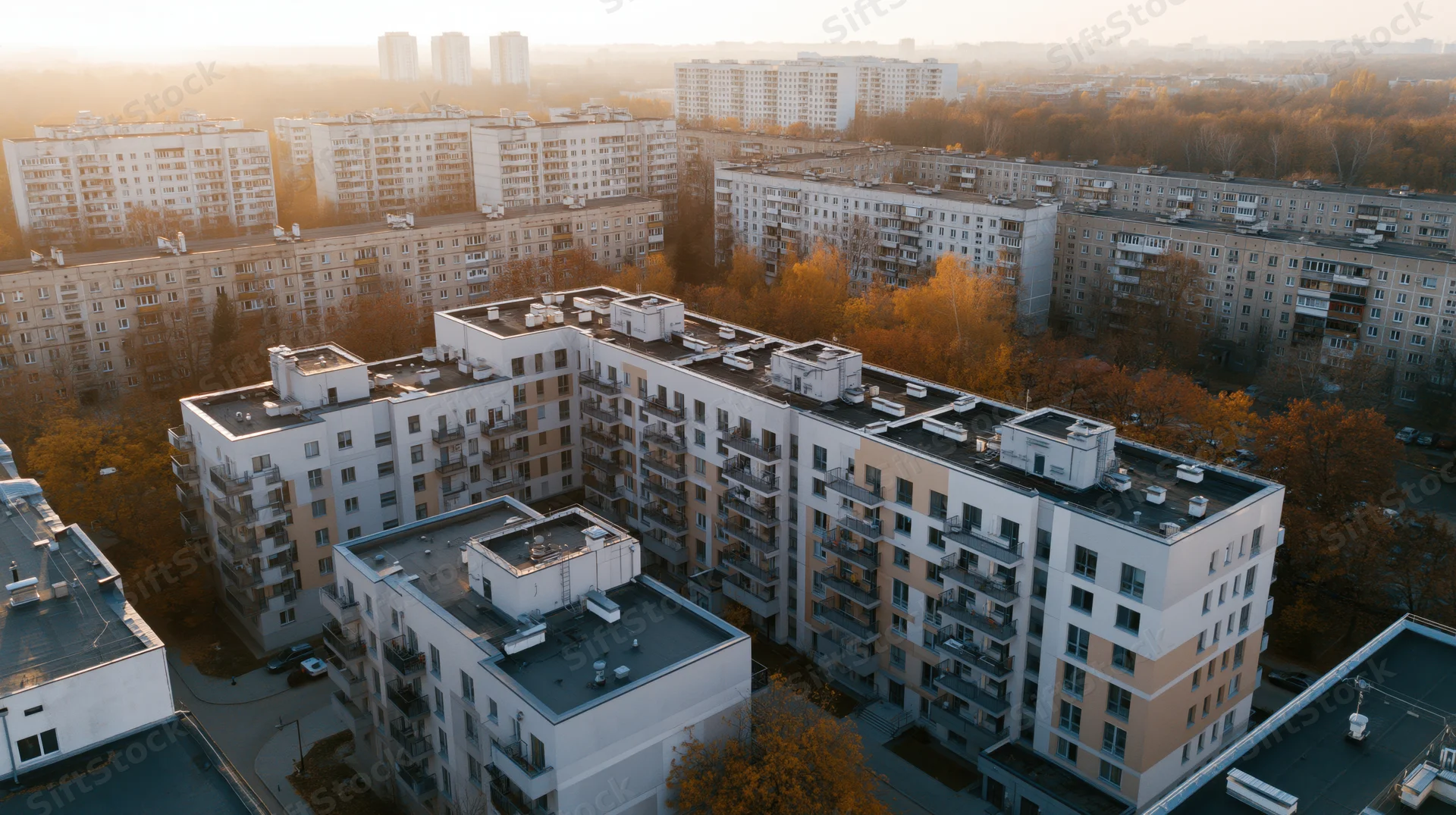 Aerial view of modern apartment buildings in a residential neighborhood at sunset