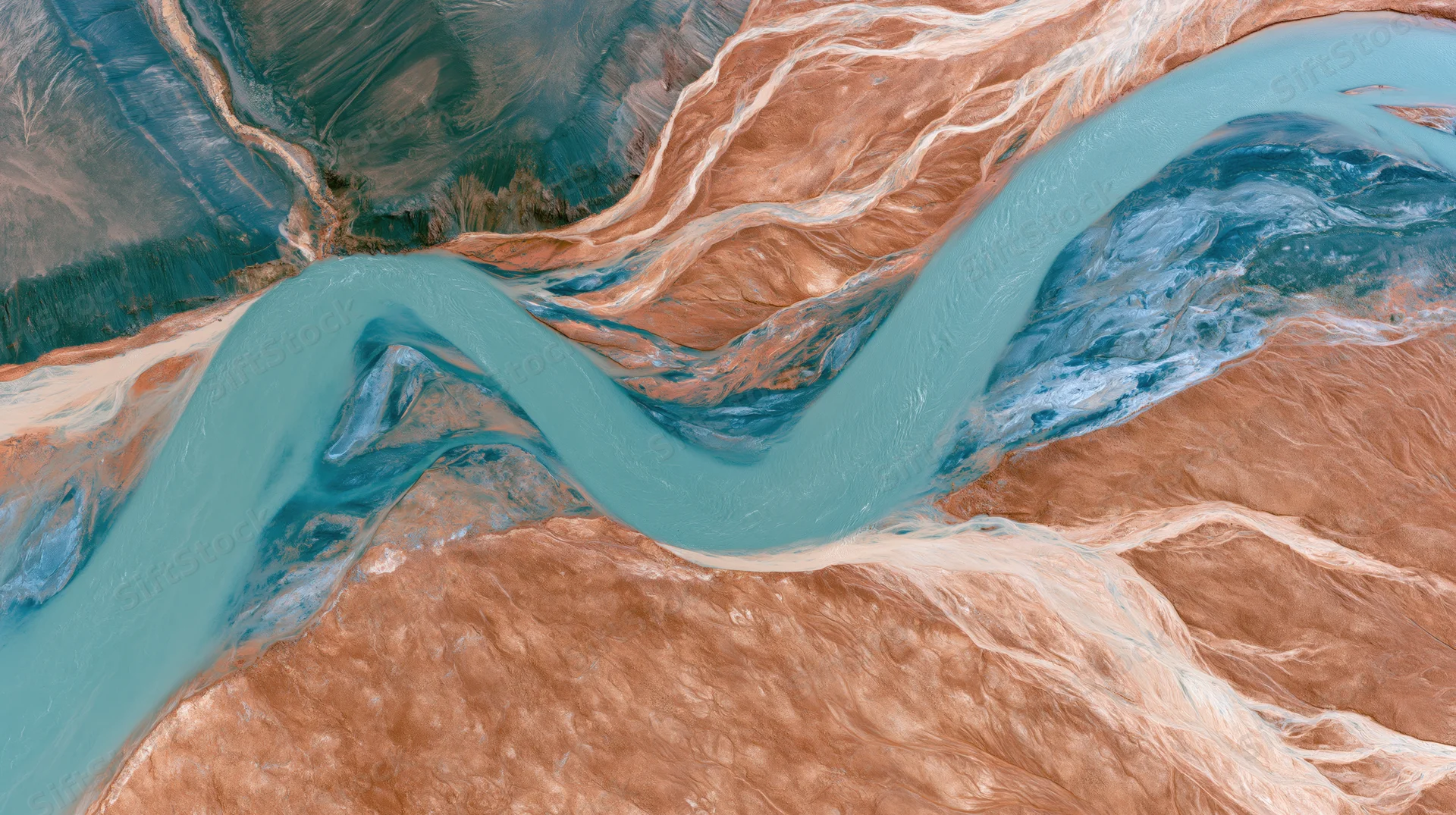 Aerial top-down view of a glacial river delta with turquoise water winding through brown sedimentary terrain