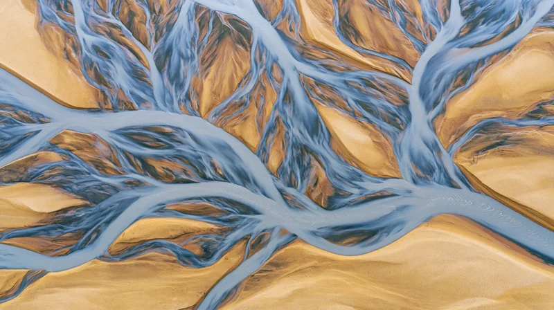 Aerial top-down view of a braided glacial river delta in iceland