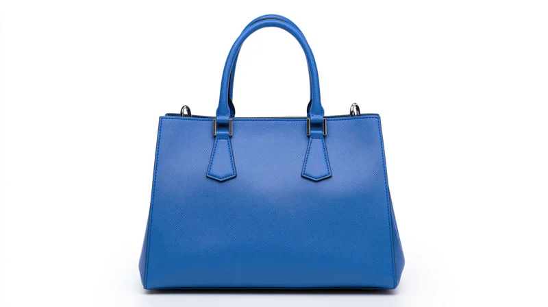 Blue saffiano leather tote handbag with dual top handles on white background