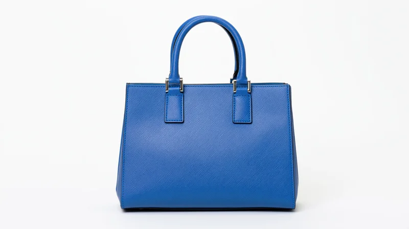 Blue saffiano leather tote handbag with dual top handles on white background