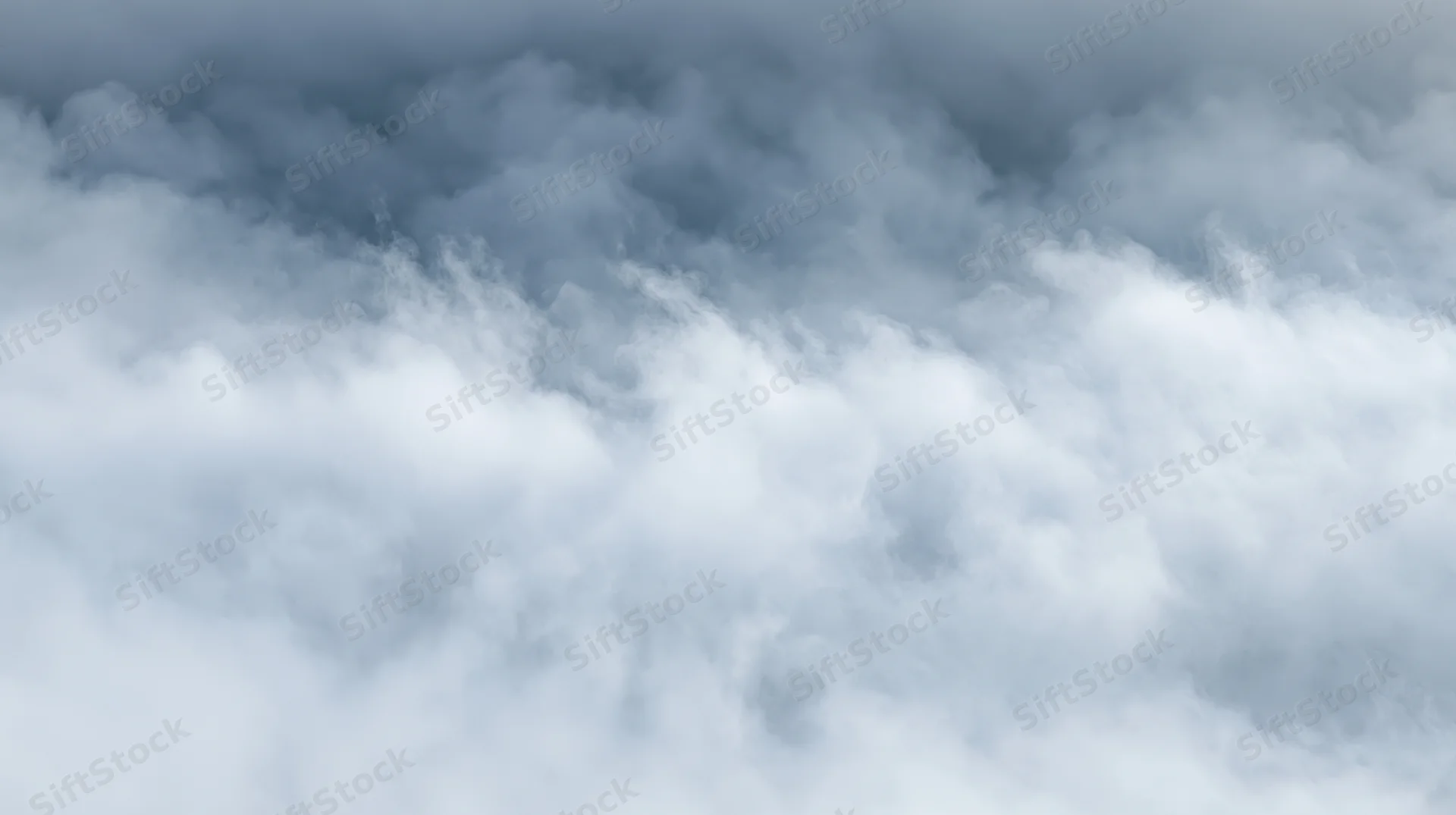 Dense white and grey smoke filling the frame with swirling vapor and soft light