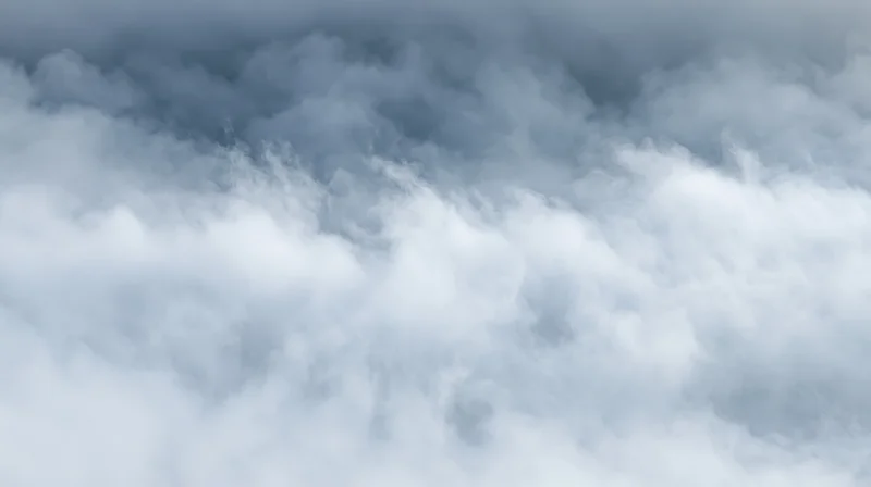 Dense white and grey smoke filling the frame with swirling vapor and soft light
