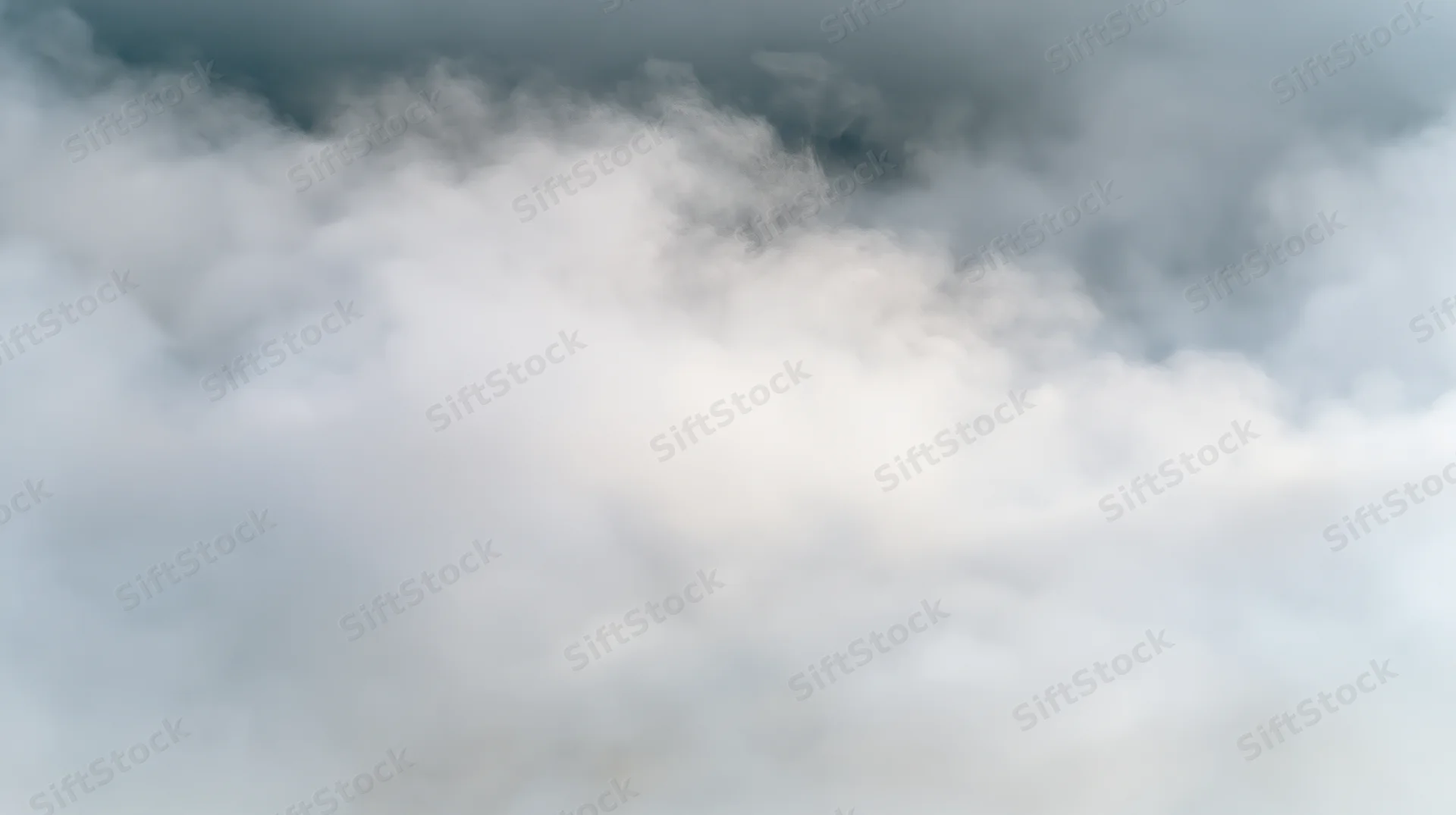 Dense white and grey smoke filling the frame with soft swirling clouds and atmospheric haze