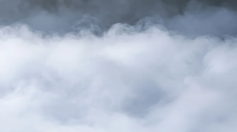 Dense white and grey smoke filling the frame with soft swirling patterns