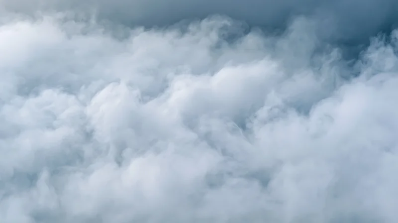 Dense white and grey smoke filling the frame in a swirling cloud formation