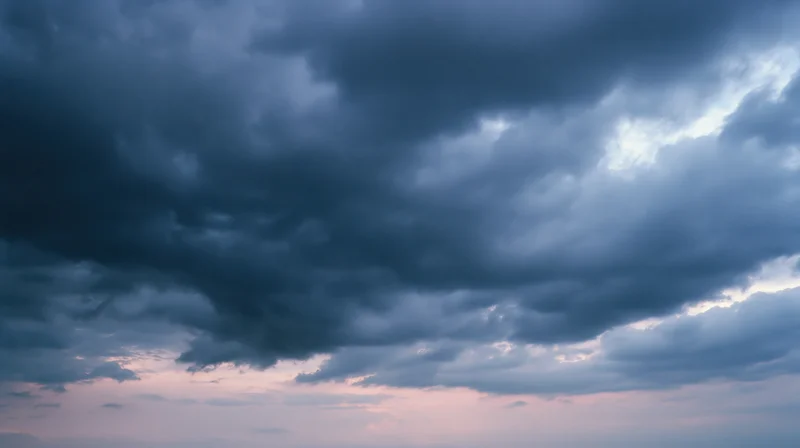 Dramatic stormy sky filled with dark cumulonimbus clouds at twilight