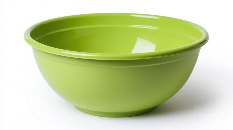 Lime-green plastic mixing bowl centered upright on white background