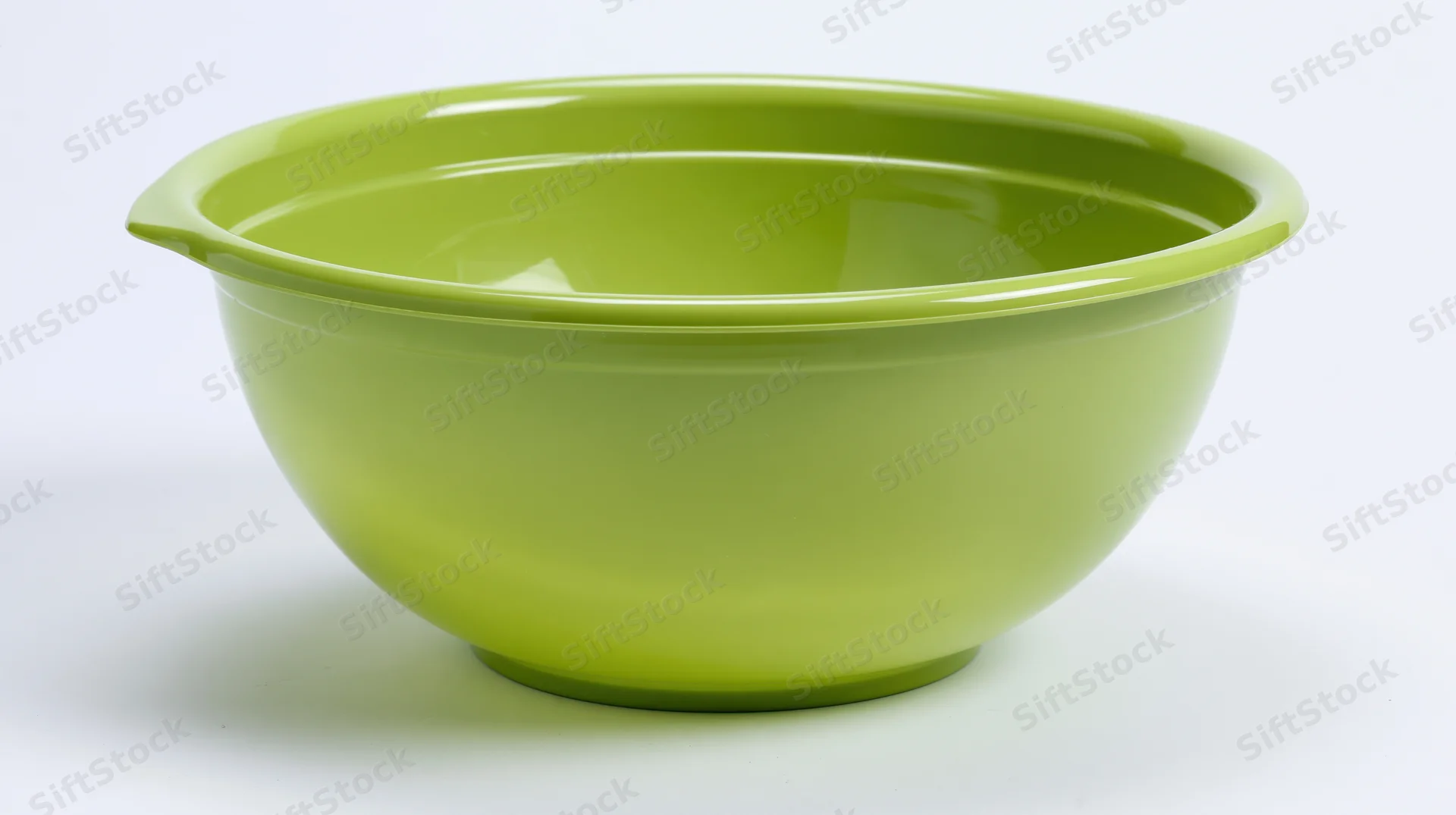 Lime-green plastic mixing bowl centered on white background