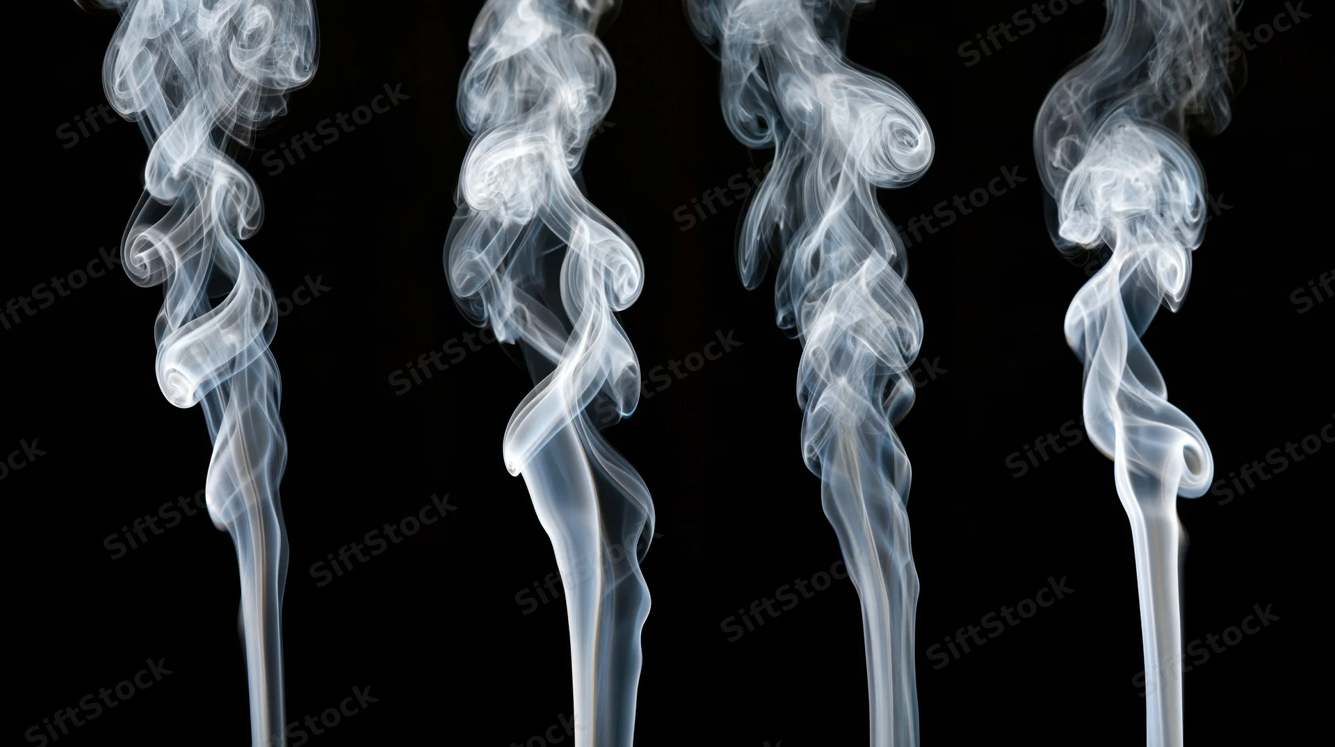 Four vertical wisps of white smoke rising against a black background