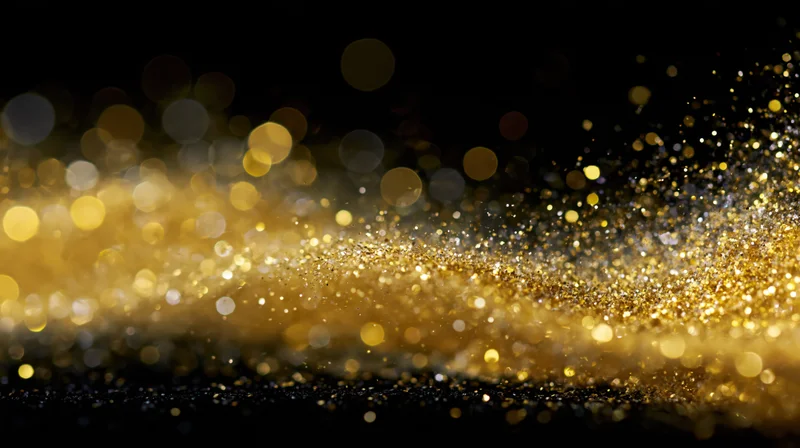 Gold glitter particles drifting in a diagonal wave across a dark background