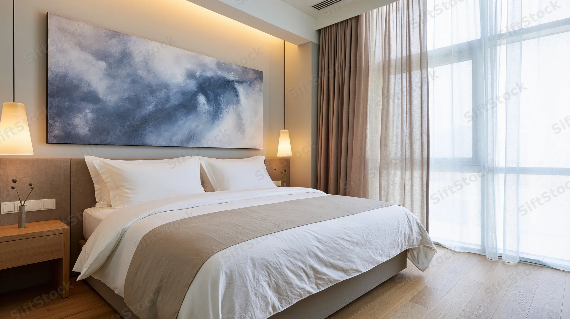 Minimalist hotel bedroom with king-size bed and abstract artwork above the headboard near a large window with sheer curtains