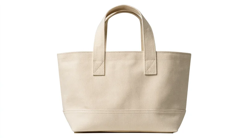 Cream canvas tote bag with flat handles centered on white background