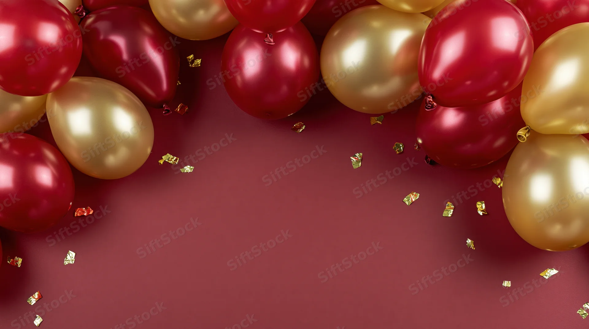 Red and gold metallic balloons clustered along edges with scattered confetti on maroon surface