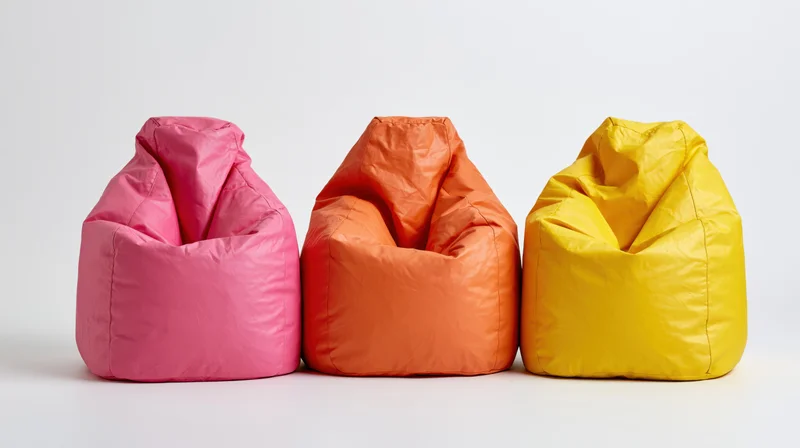 Three colorful beanbag chairs arranged in a row on a white background