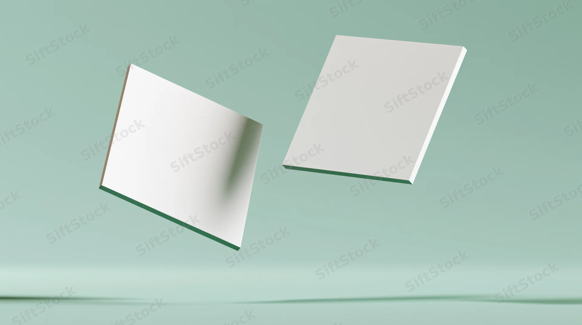 Two blank white square cards floating at slight angles against a mint green background