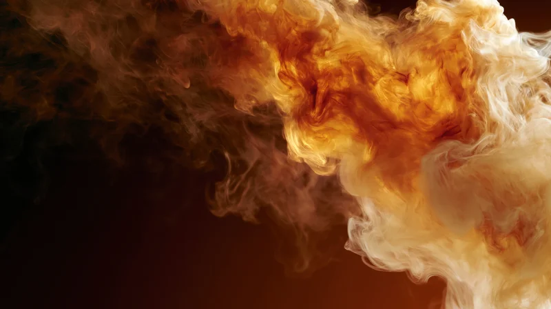 Swirling wisps of amber and cream smoke dispersing against a dark background