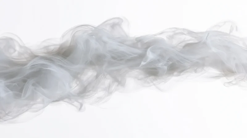 Wispy smoke drifting horizontally across a pure white background