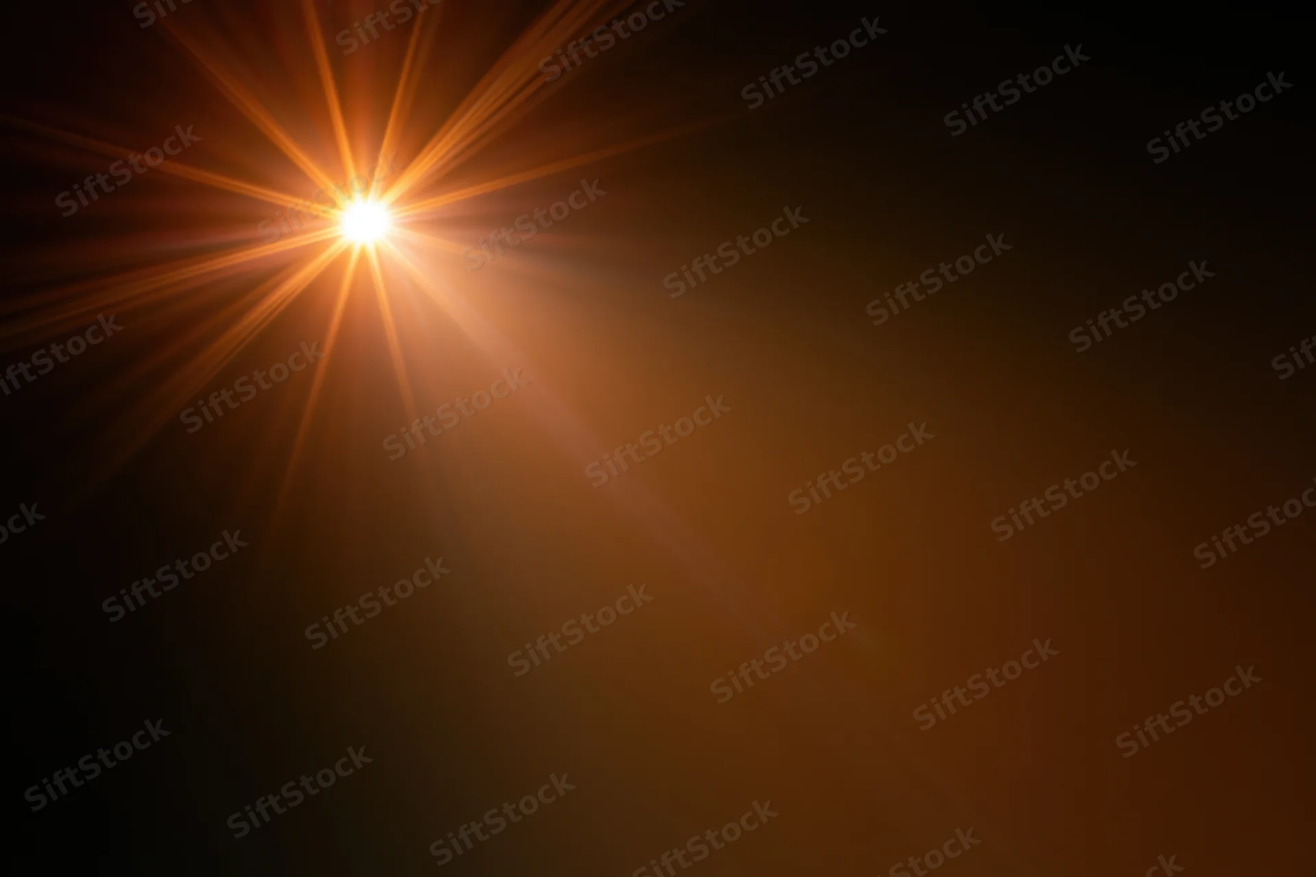 Intense light source bursting from upper left corner against dark background with radiating beams and warm glow