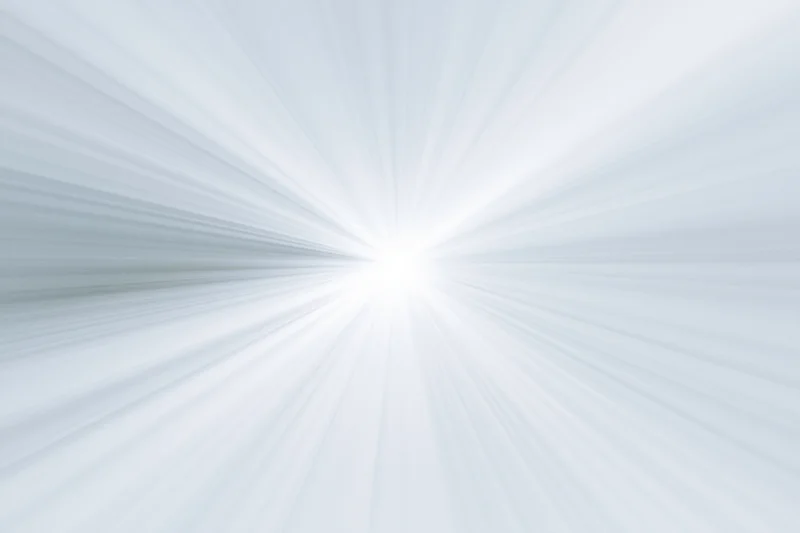 Soft radial burst of light rays emanating from a bright center
