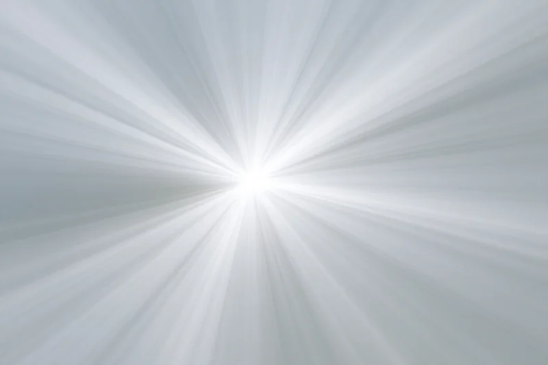 Soft radial burst of light rays emanating from a bright center