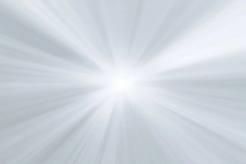 Soft radial burst of light rays emanating from a bright center