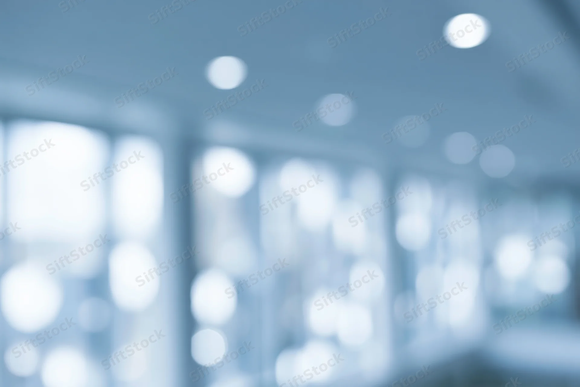 Blurred interior space with soft circular bokeh lights on ceiling and walls