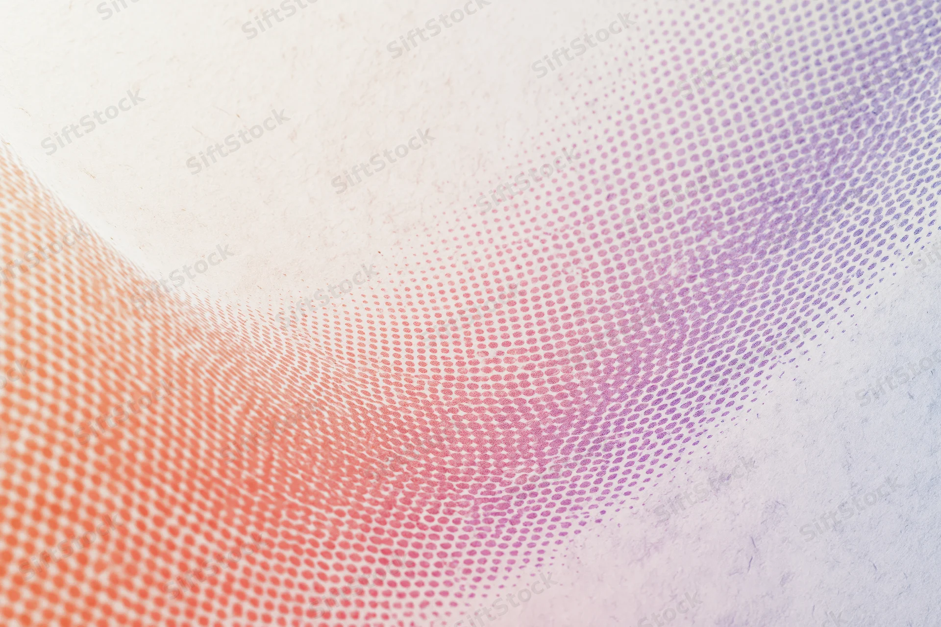 Abstract halftone dot wave flowing diagonally across a gradient background