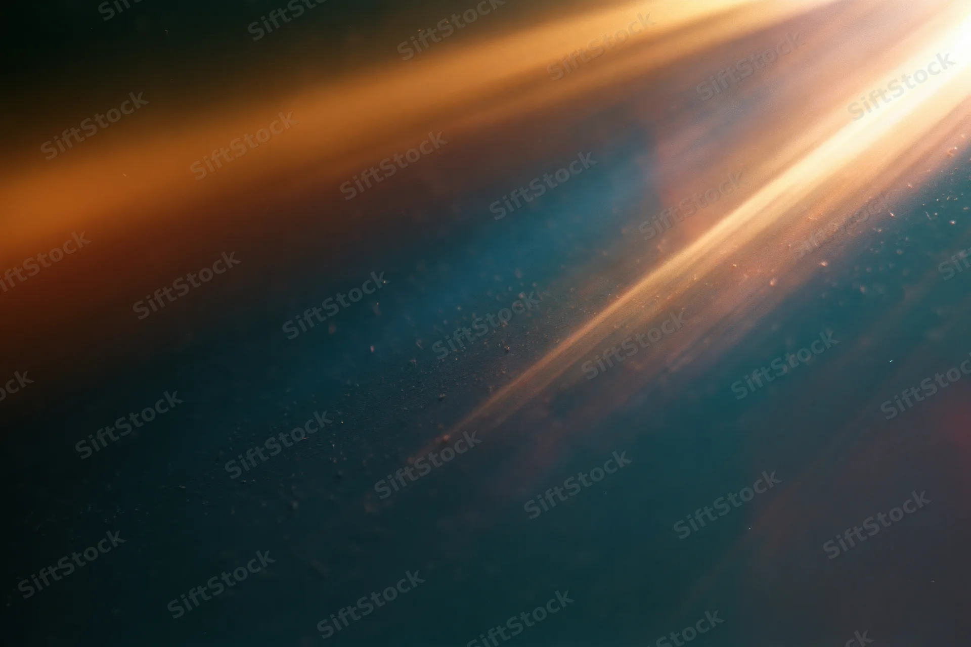 Diagonal light leak texture on dark dusty surface with floating particles