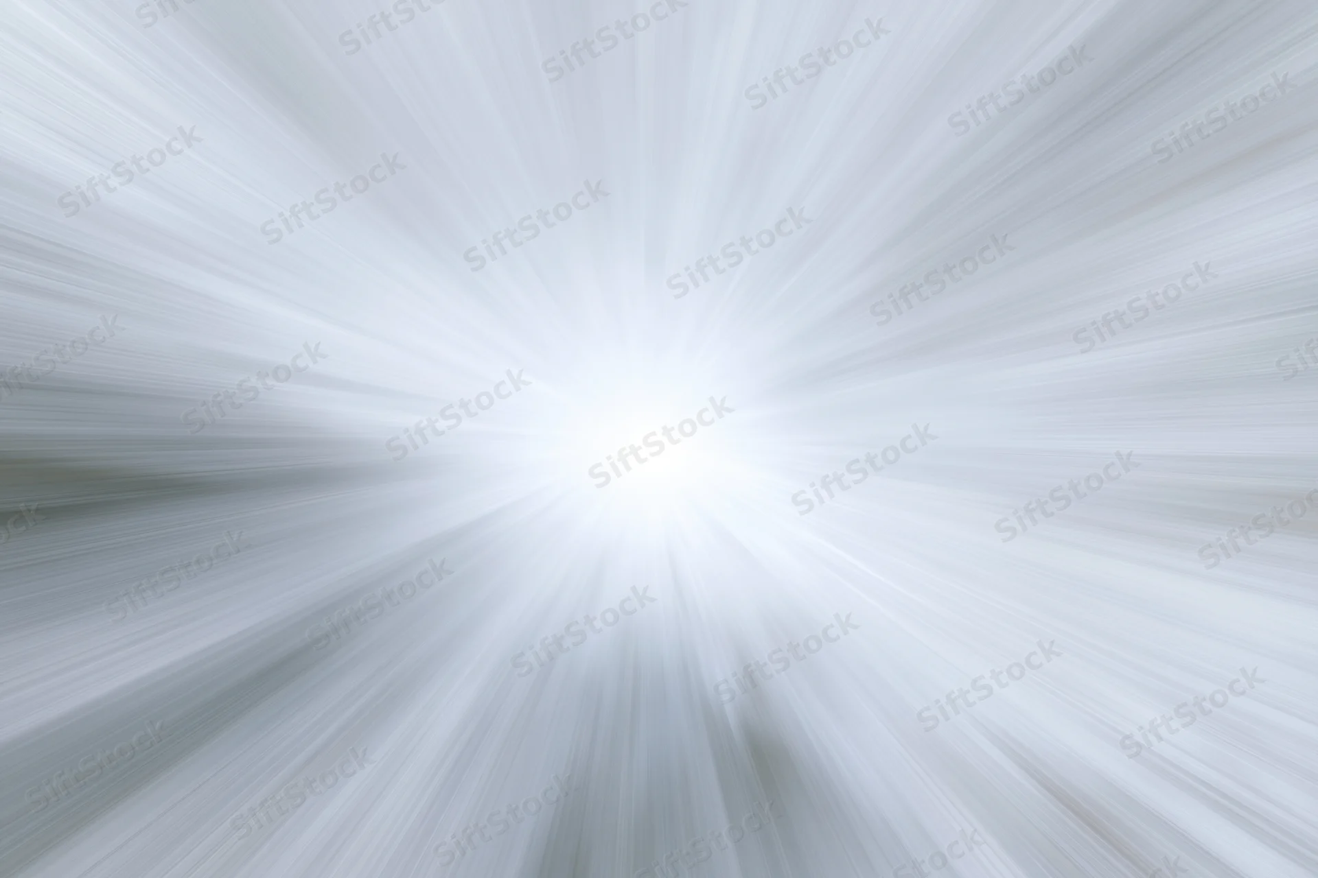 Bright white light radiating outward in radial motion blur pattern