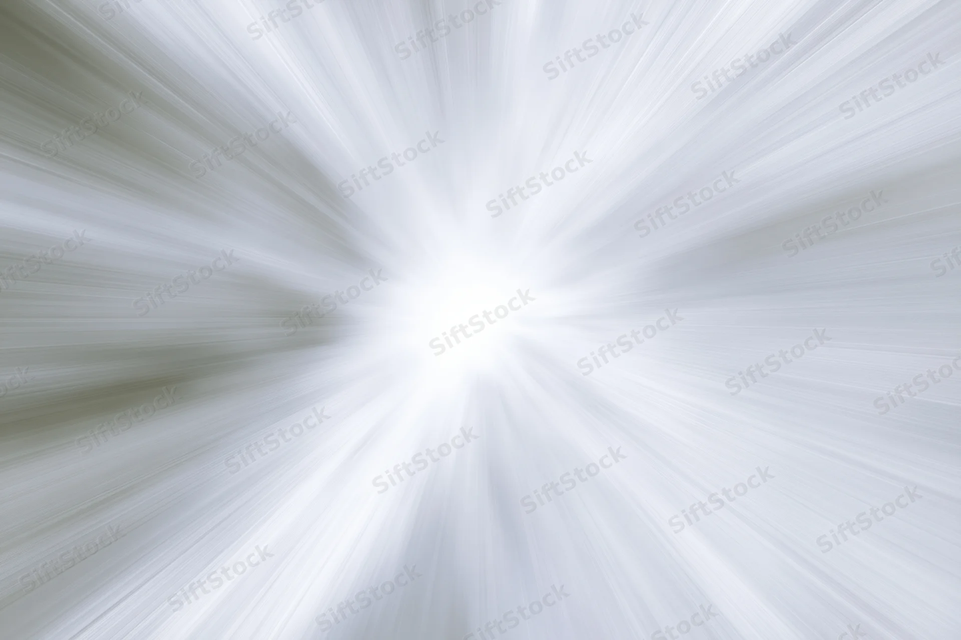 Bright white light radiating outward in radial motion blur pattern