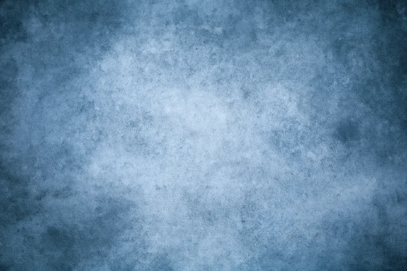 Abstract blue textured backdrop filling the frame in a studio setting