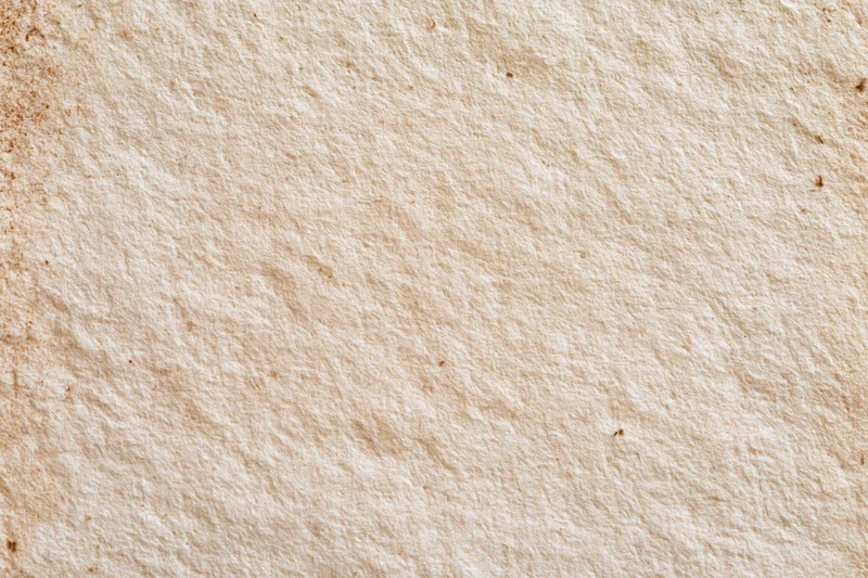 Aged paper texture filling the frame in flat lay macro view