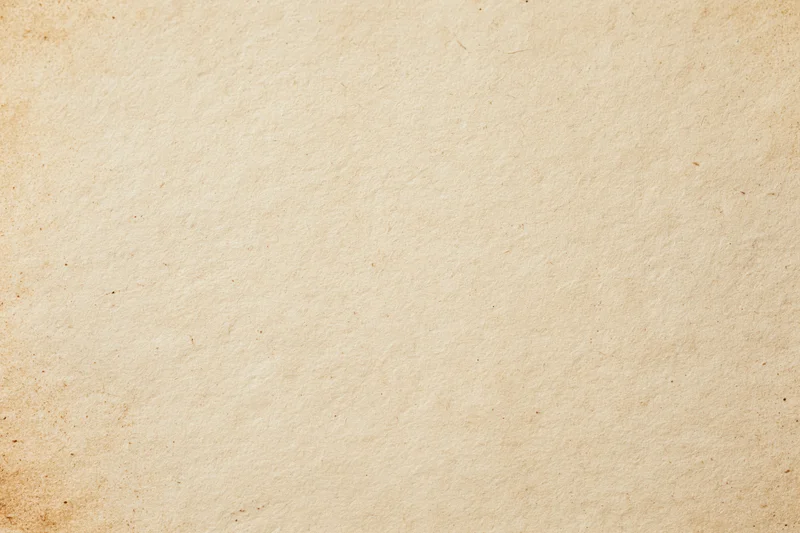 Aged paper texture filling the frame in a flat lay macro view