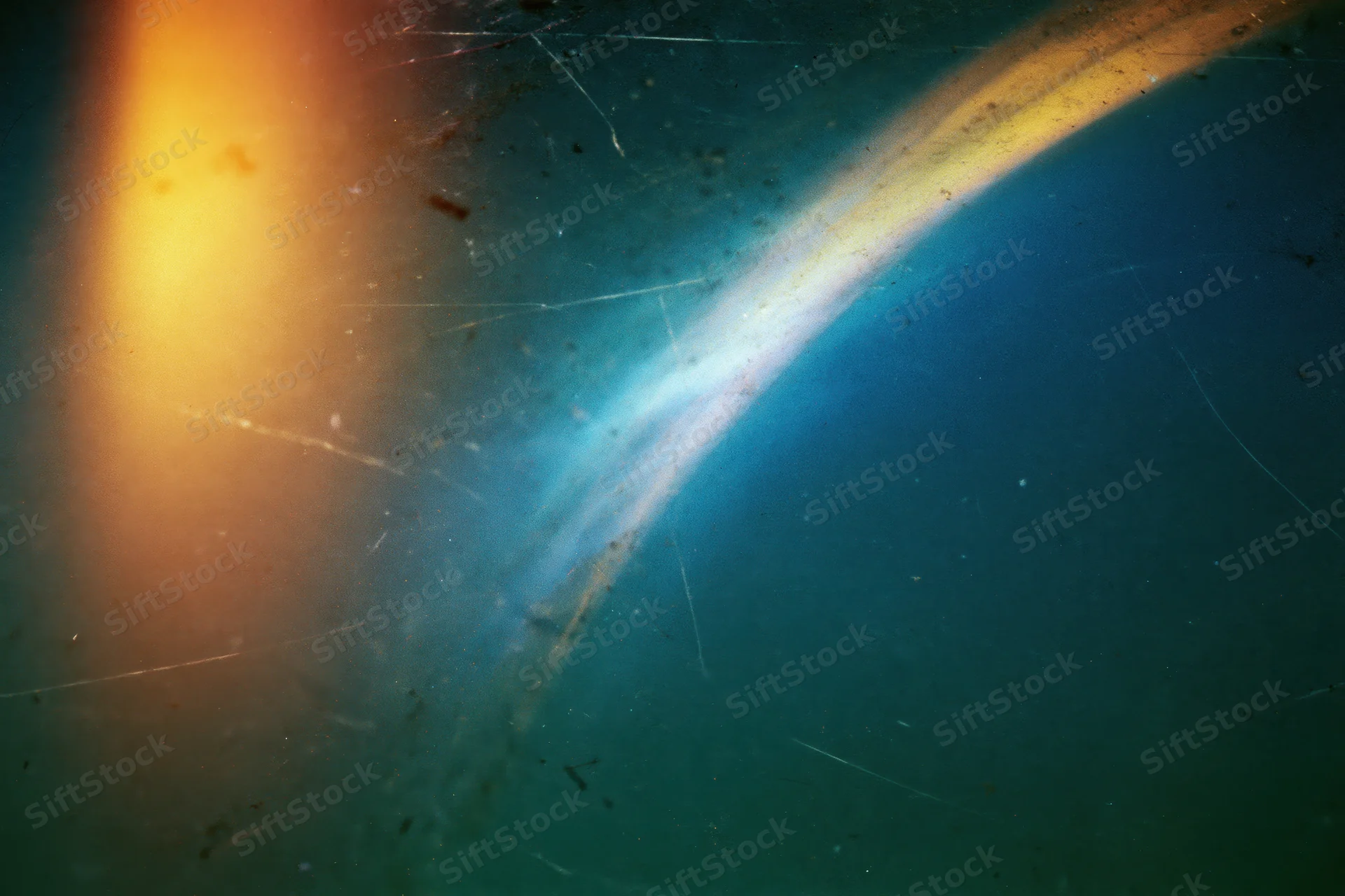 Aged film scan with light leak and lens flare across a dark blue gradient background